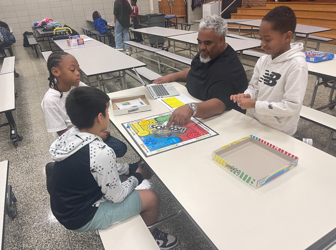 Mentor working with students on educational activities